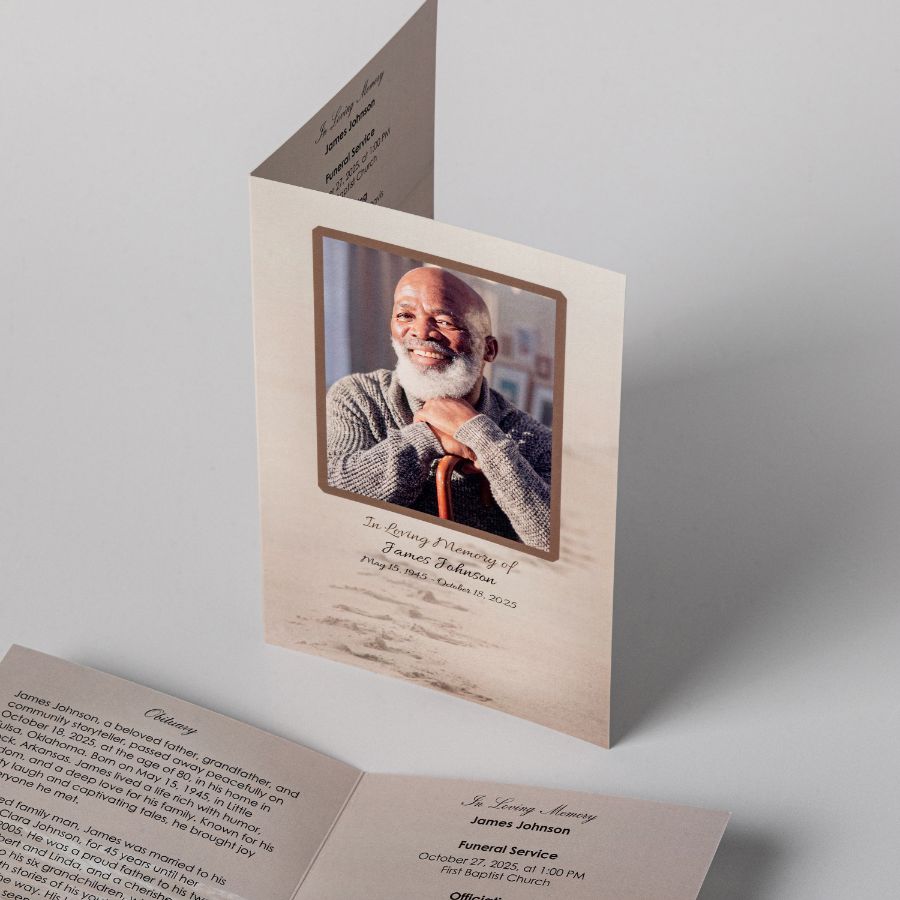 A folded memorial service program standing open at its cover photograph, with a second program lying open to the obituary and order of service