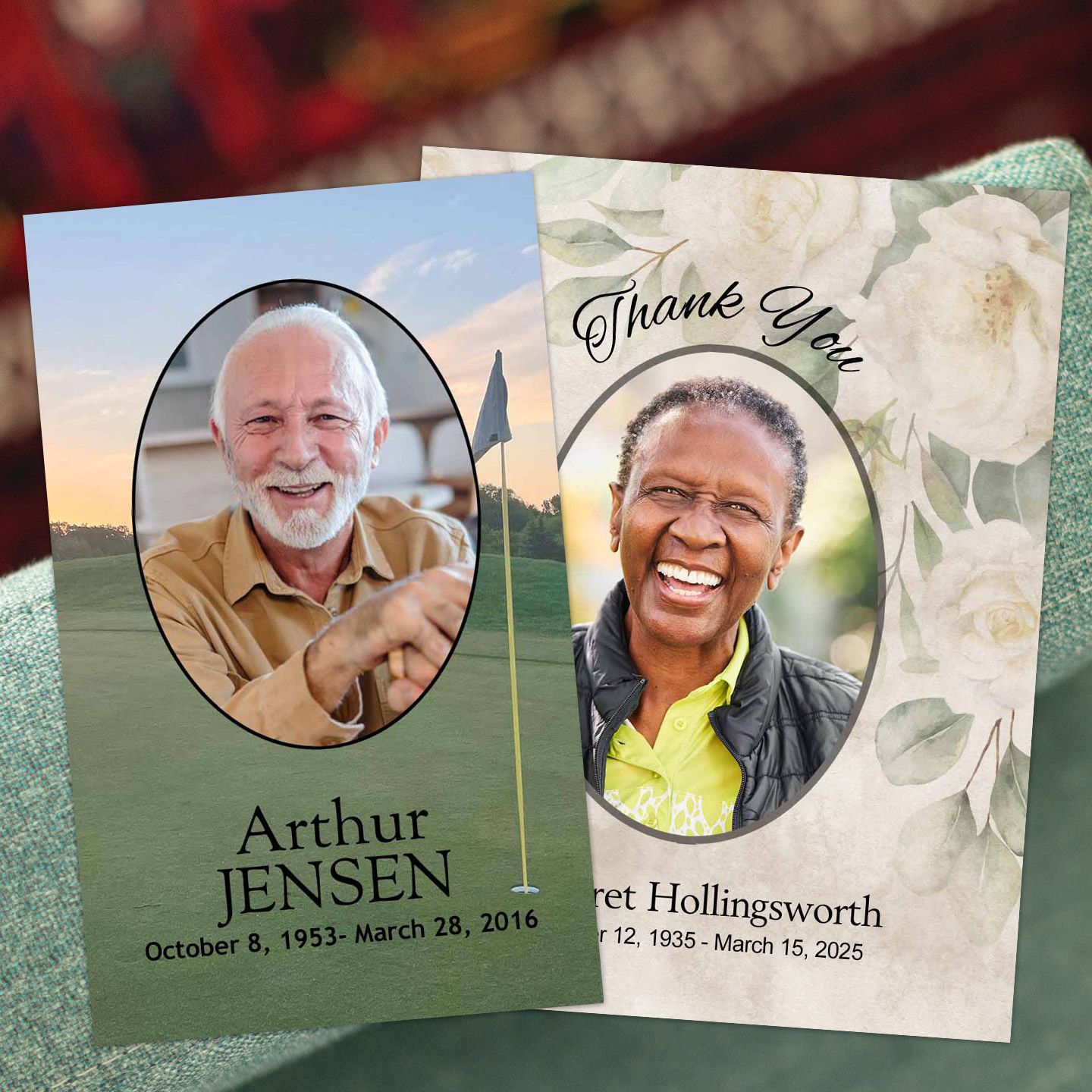 Two memorial photo cards resting on soft fabric, each with an oval portrait, a name and dates of birth and death