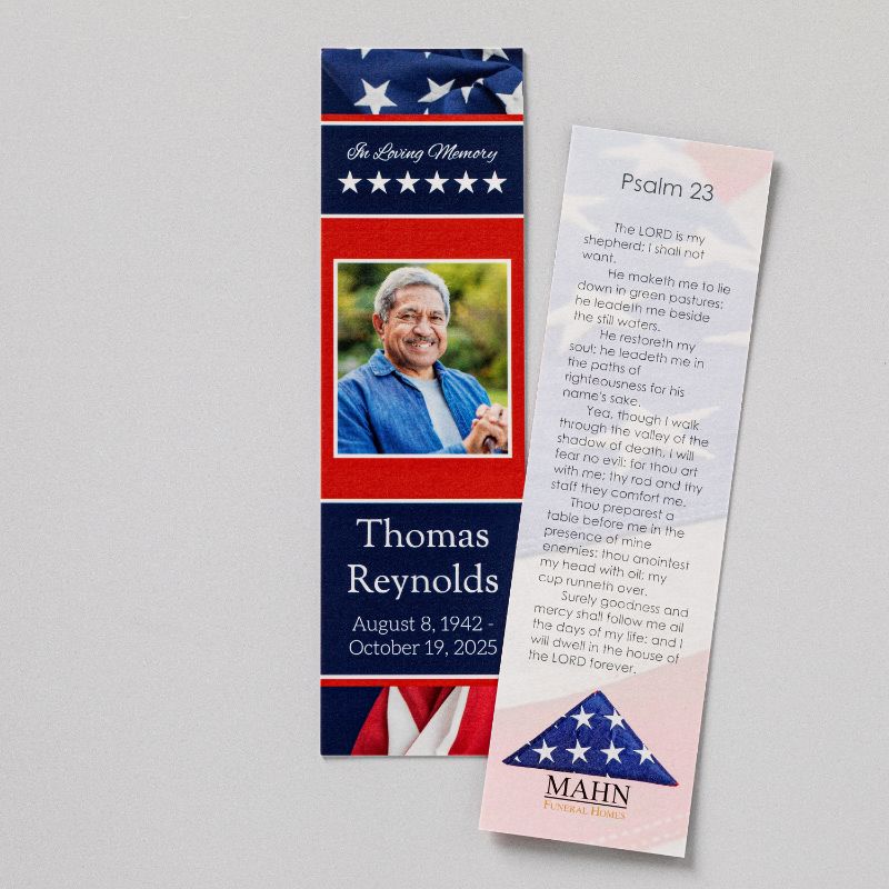 Front and back of a memorial bookmark — a photograph, name, and dates on an American flag design, with Psalm 23 and the funeral home logo on the reverse